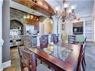 58 Sunfish Street Destin, FL 32541 - Photo 8 of 32 a dining room with furniture a chandelier and wooden floor