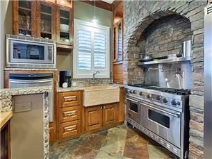 58 Sunfish Street Destin, FL 32541 - Photo 10 of 32 a stove top oven sitting inside of a kitchen