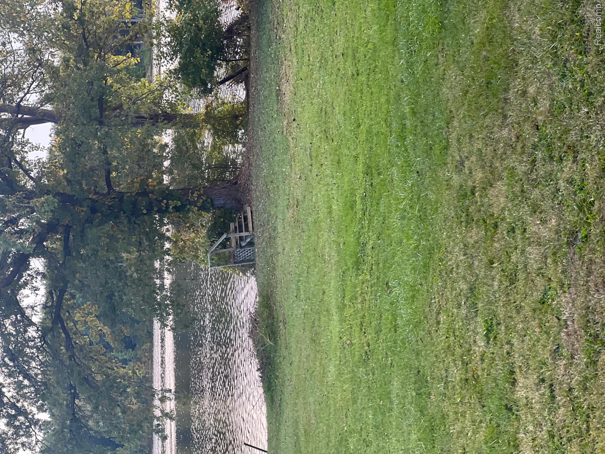 3364 East Pierson Road Flint, MI 48506 - Photo 56 of 67 View of grassy yard featuring a water view