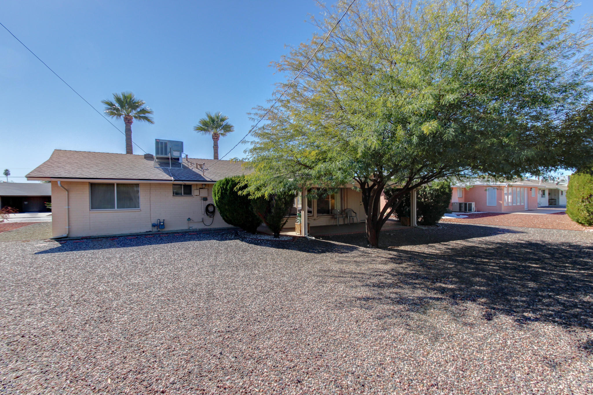 10008 West Riviera Drive Sun City, AZ 85351 - Photo 25 of 26 a front view of a house with a yard