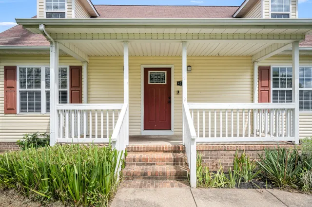 a front view of a house with a porch