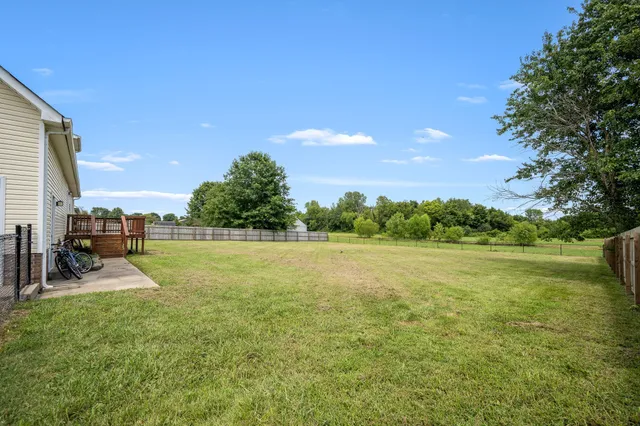 a view of a lake with a yard