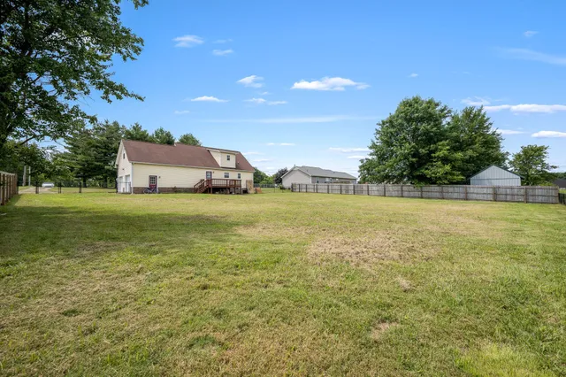 a view of a building with a yard