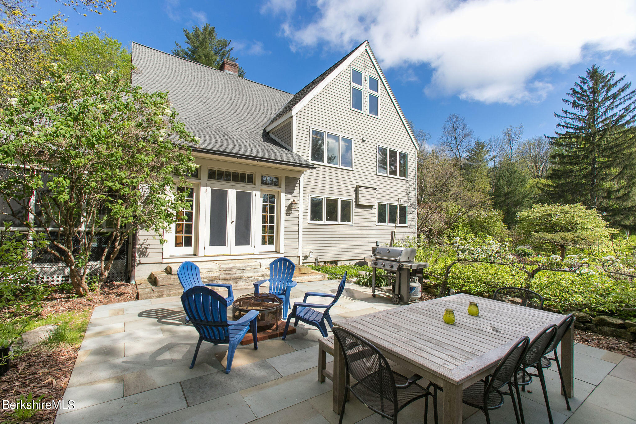 15 W Road Alford, MA 01266 - Photo 18 of 64 a view of a dinning table and chairs in the patio