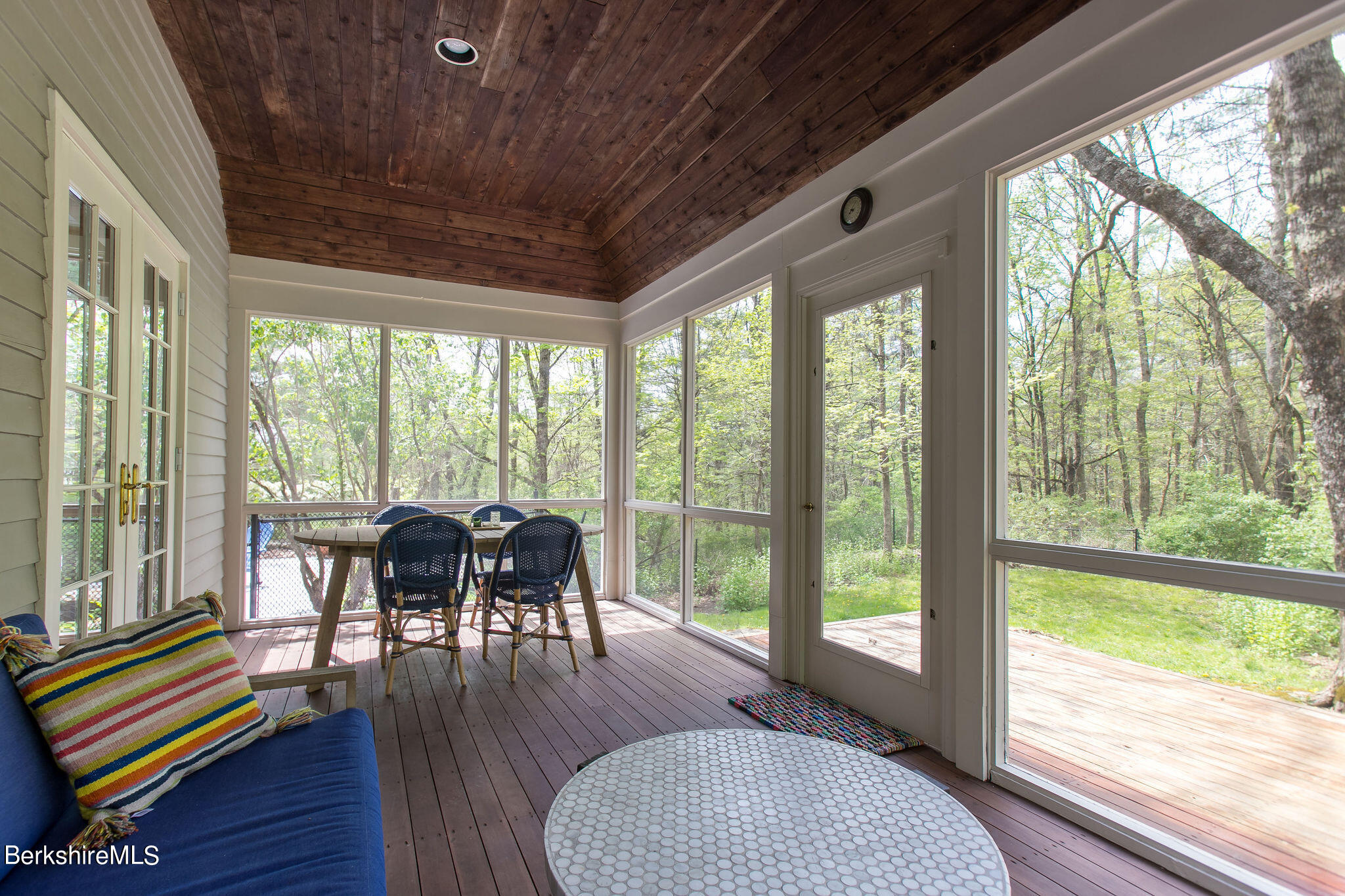 15 W Road Alford, MA 01266 - Photo 22 of 64 a dining room with wooden floor glass table and chairs