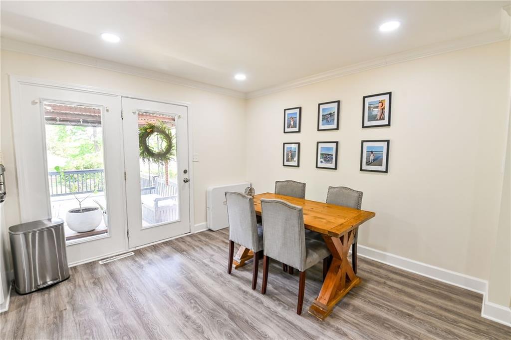 150 Sims Street Winder, GA 30680 - Photo 13 of 61 a view of a dining room with furniture and wooden floor