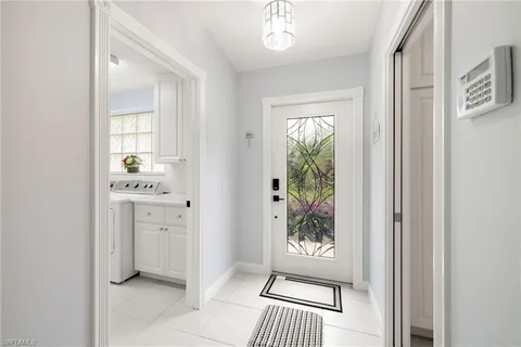 a view of an entryway with wooden floor