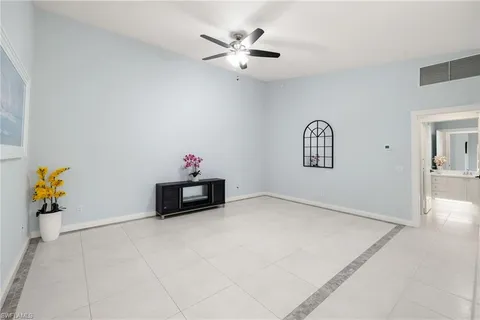 a large kitchen with kitchen island granite countertop a large window and a fireplace