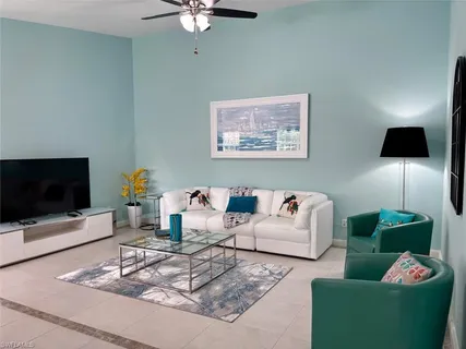 a living room with furniture and a flat screen tv