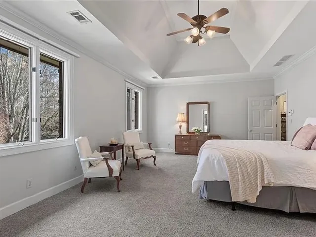 a bedroom with bed and window