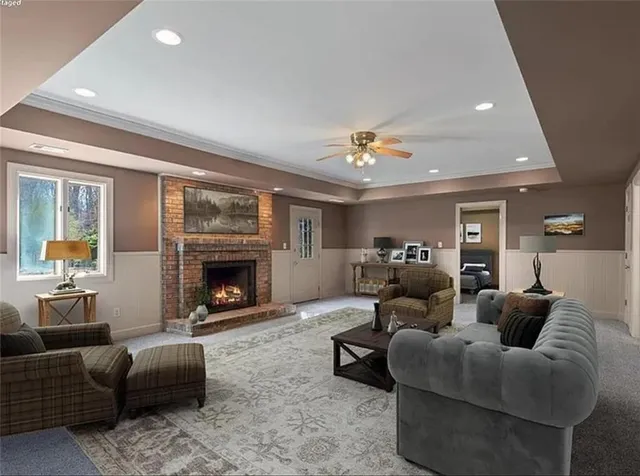 a living room with furniture and a fireplace