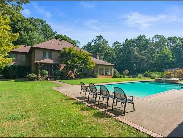 a patio with table and chairs