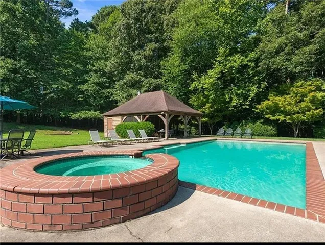 a view of swimming pool with a garden