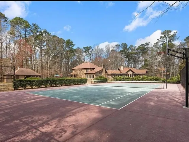 a view of a park with large trees