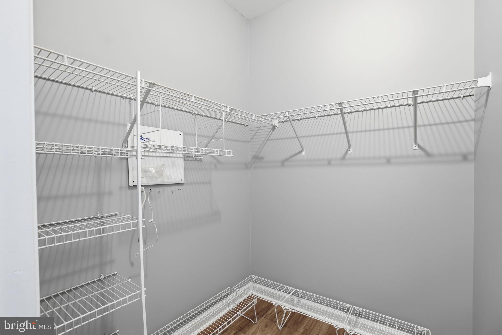 7871 Rolling Woods Court, Unit 1104 Springfield, VA 22152 - Photo 24 of 38 a view of a room with racks on the wall