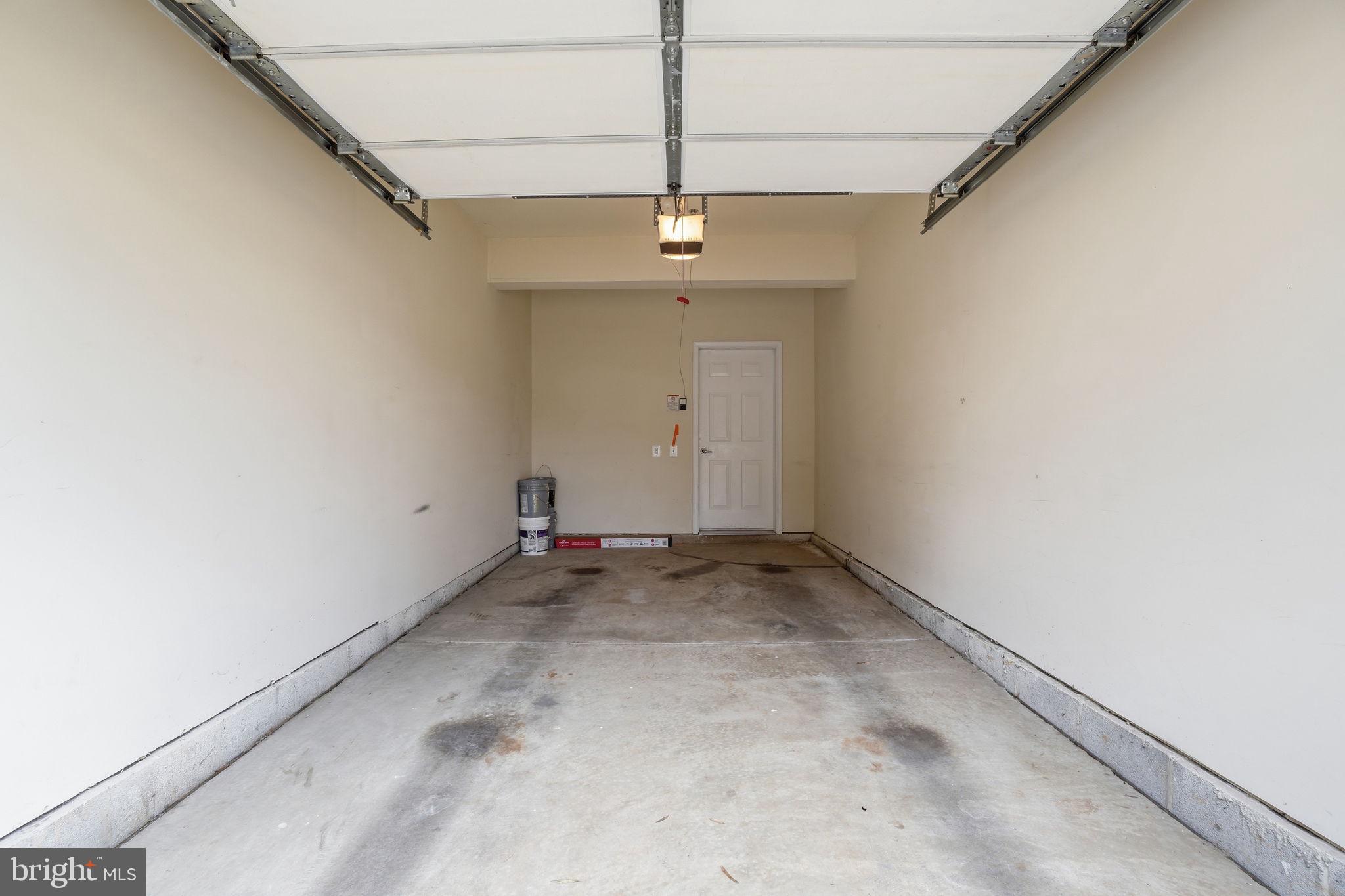 7871 Rolling Woods Court, Unit 1104 Springfield, VA 22152 - Photo 29 of 38 an empty room with a ceiling fan and carpet