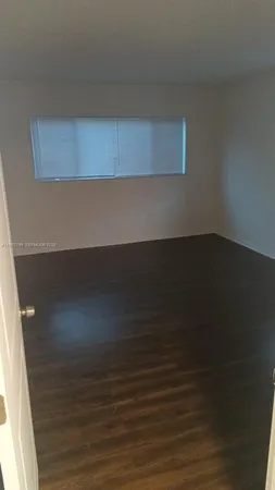 a bathroom with a sink mirror and toilet