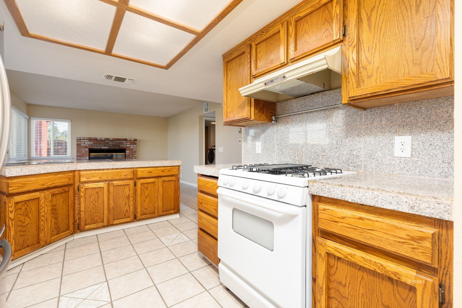 428 North Kern Street Ridgecrest, CA 93555 - Photo 10 of 30 a kitchen with granite countertop a sink stainless steel appliances and cabinets