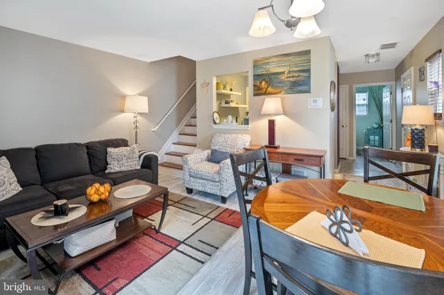 a living room with furniture and a table