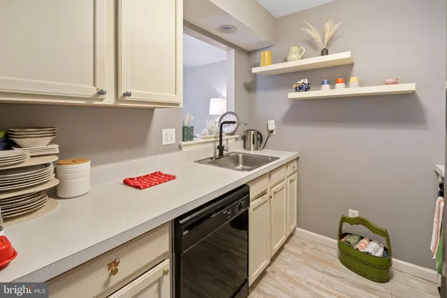 a kitchen with a sink and cabinets