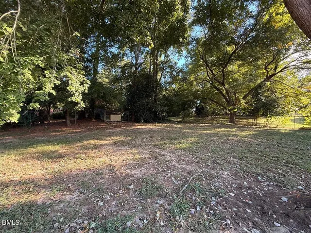 a view of outdoor space with deck and yard