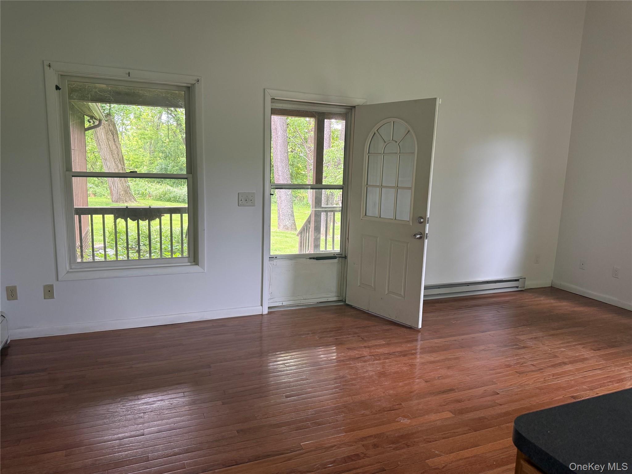 183 Barrytown Road Barrytown, NY 12507 - Photo 20 of 41 an empty room with wooden floor and windows
