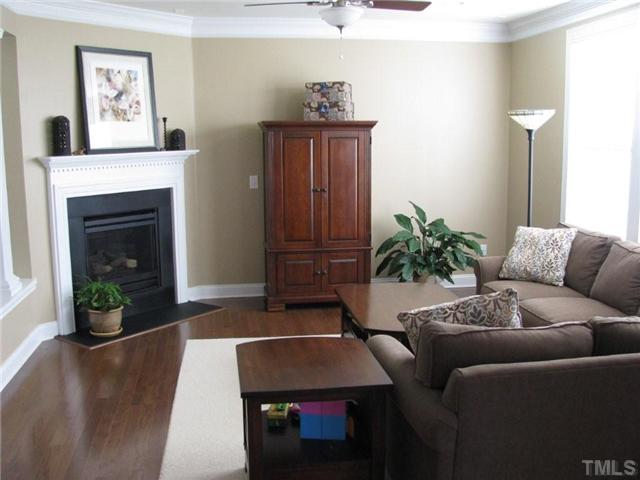13019 Saxon Way Raleigh, NC 27613 - Photo 5 of 12 Transitional great room with gas log fireplace. New two inch blinds on all windows!
