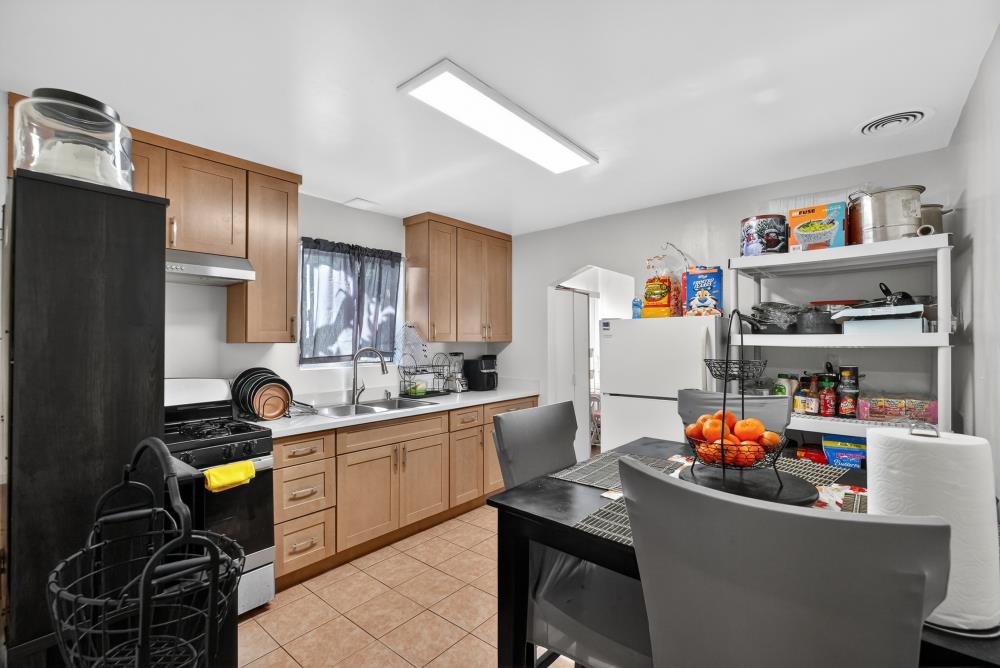33554 7th Street Union City, CA 94587 - Photo 12 of 38 a room with furniture a flat screen tv and a table