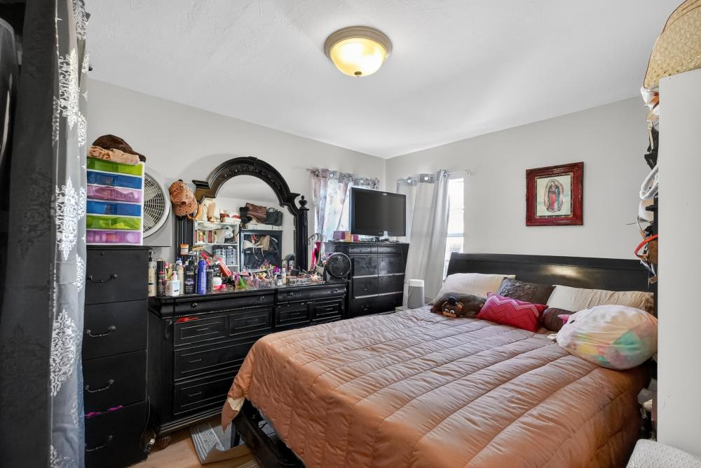 33554 7th Street Union City, CA 94587 - Photo 14 of 38 a bedroom with a bed and a dresser
