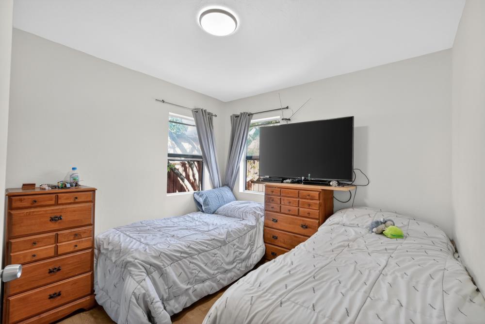 33554 7th Street Union City, CA 94587 - Photo 19 of 38 a bedroom with two bed and a flat screen tv