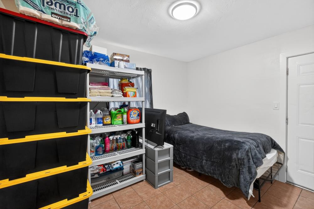 33554 7th Street Union City, CA 94587 - Photo 23 of 38 a bedroom with a bed and a book shelf