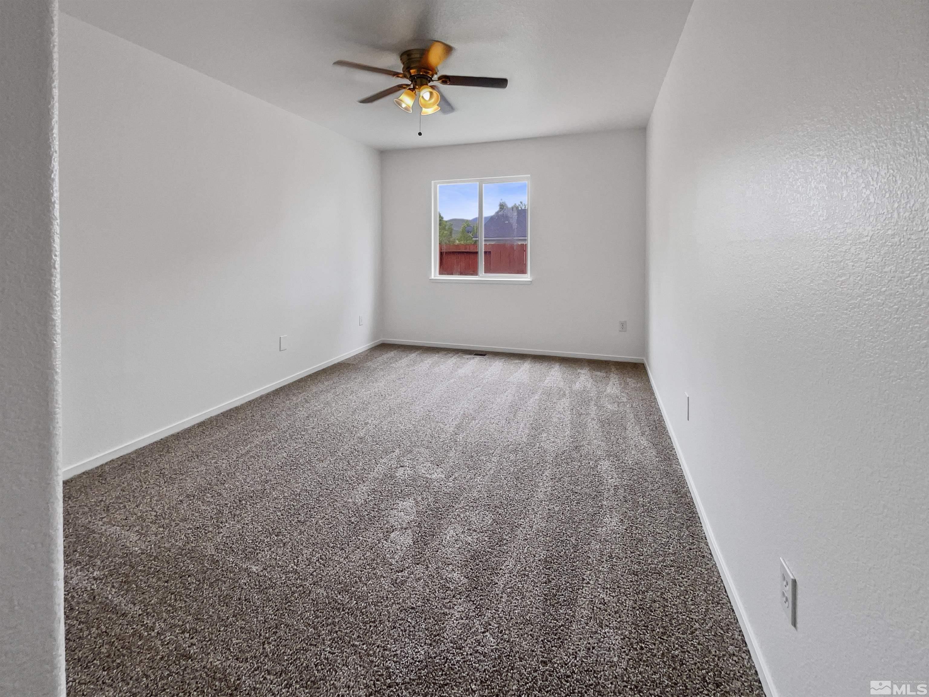 17838 Empire Court Reno, NV 89508 - Photo 13 of 20 an empty room that has a window in it