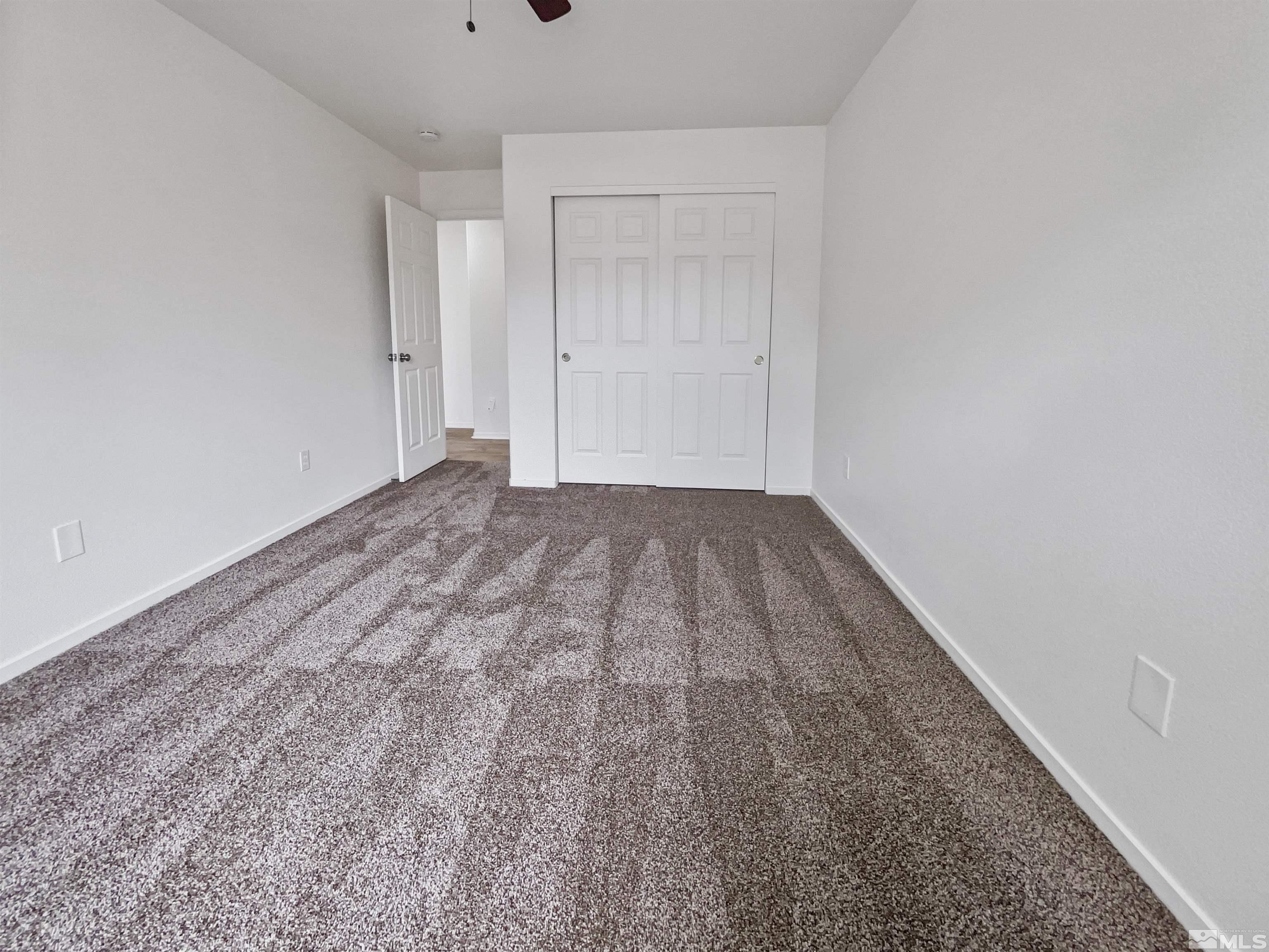 17838 Empire Court Reno, NV 89508 - Photo 14 of 20 a view of a room with a wooden floor