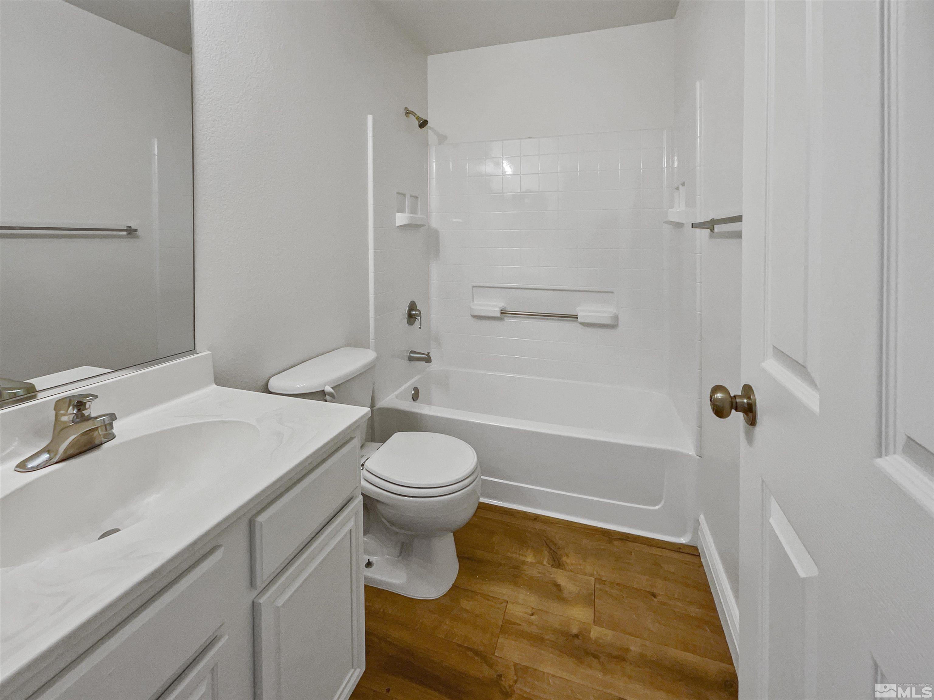 17838 Empire Court Reno, NV 89508 - Photo 16 of 20 a bathroom with a sink a toilet and shower