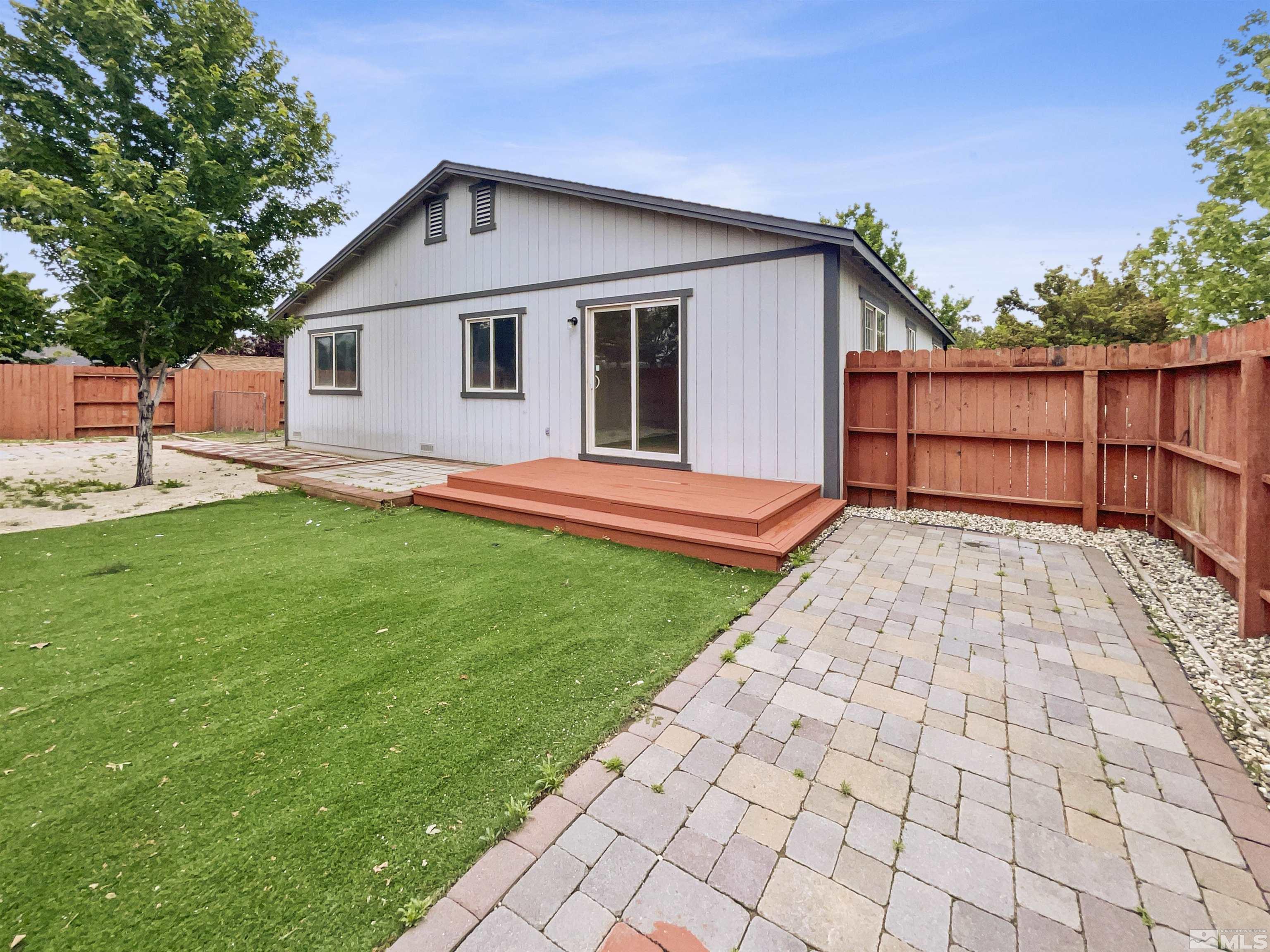 17838 Empire Court Reno, NV 89508 - Photo 6 of 20 a front view of house with yard and green space