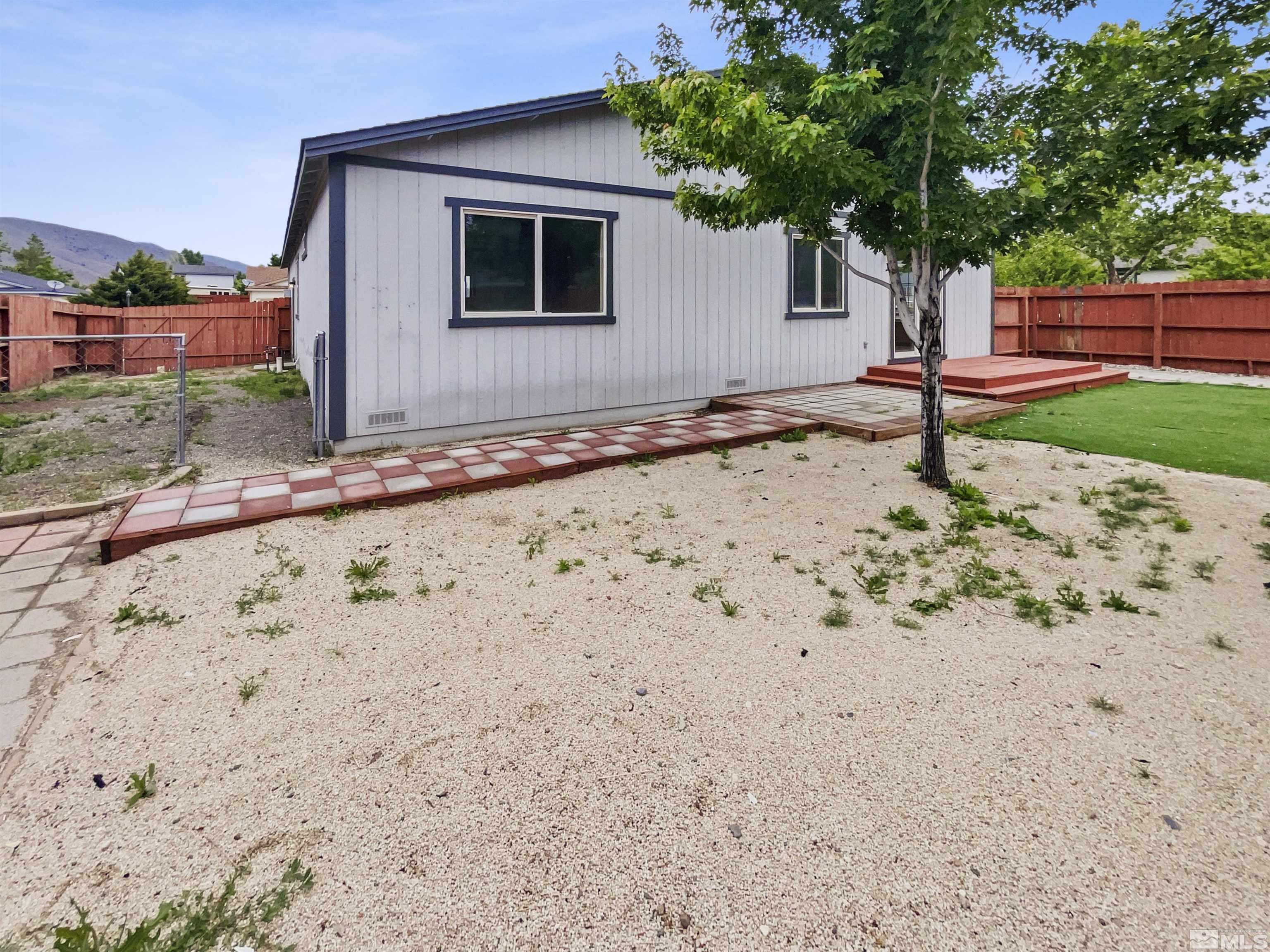 17838 Empire Court Reno, NV 89508 - Photo 7 of 20 a front view of a house with garden