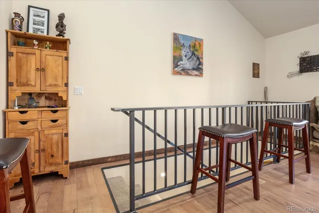 a view of a hallway with seating area
