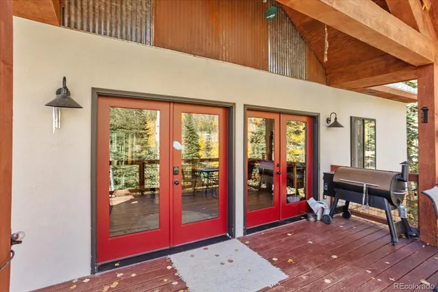 a living room with furniture a dining table and a large window