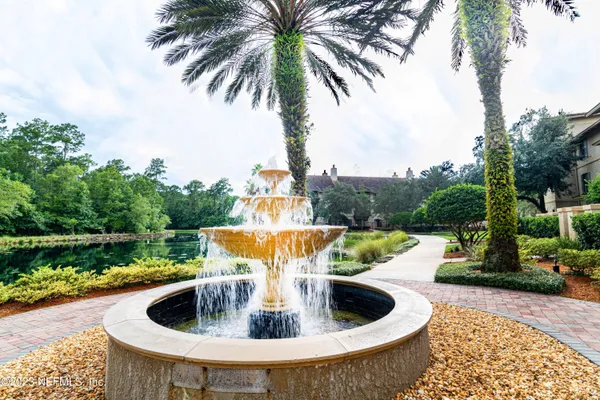 a view of swimming pool with a lounge chairs in a patio