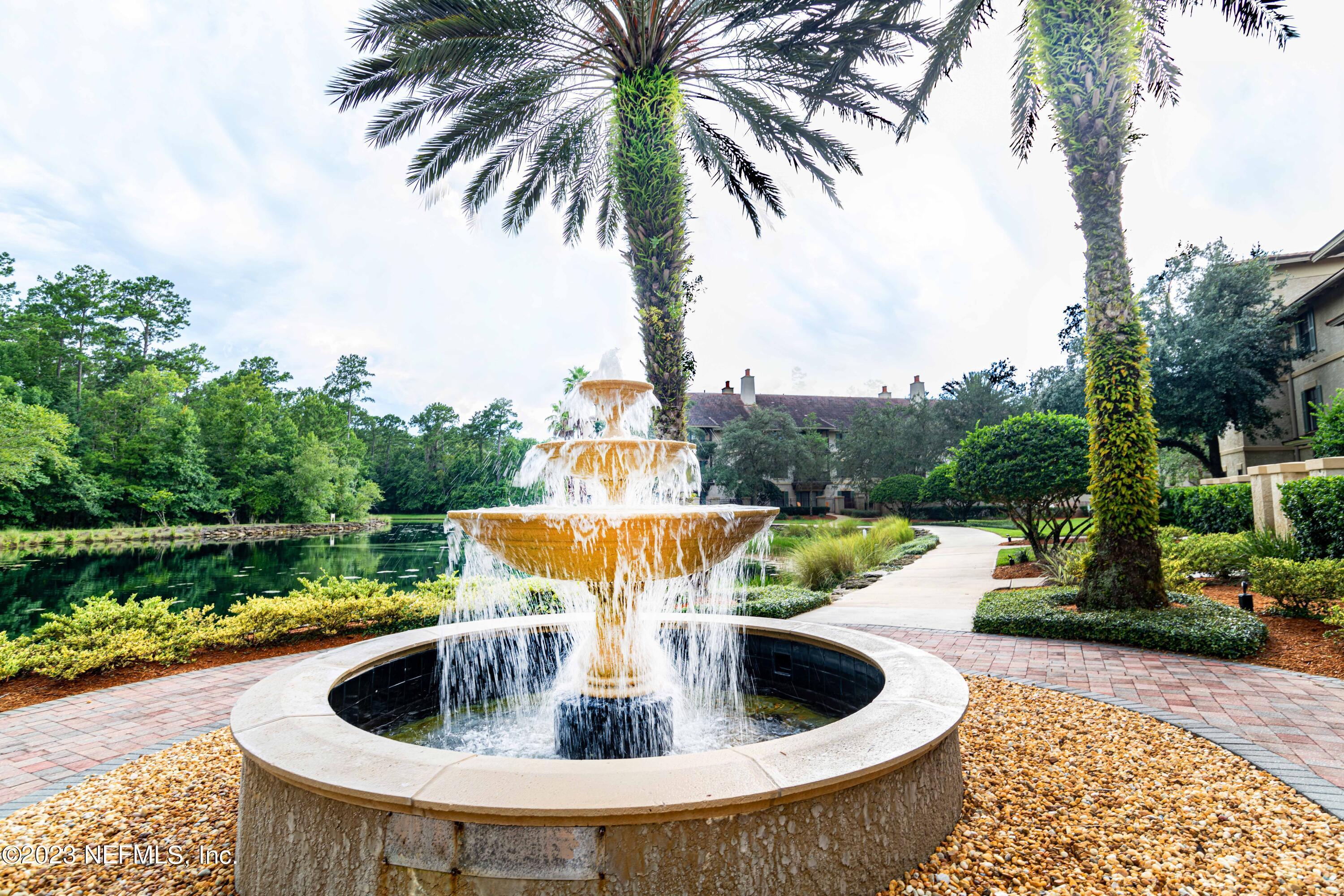 a view of swimming pool with a lounge chairs in a patio