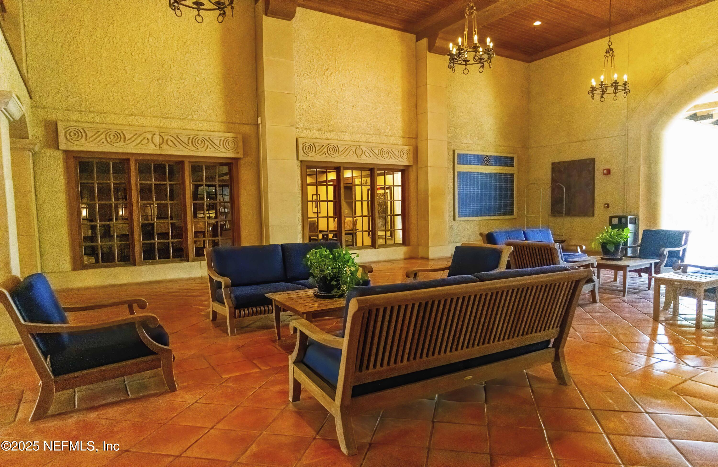 945 Registry Boulevard, Unit 212 St. Augustine, FL 32092 - Photo 12 of 26 a balcony with furniture and a potted plant