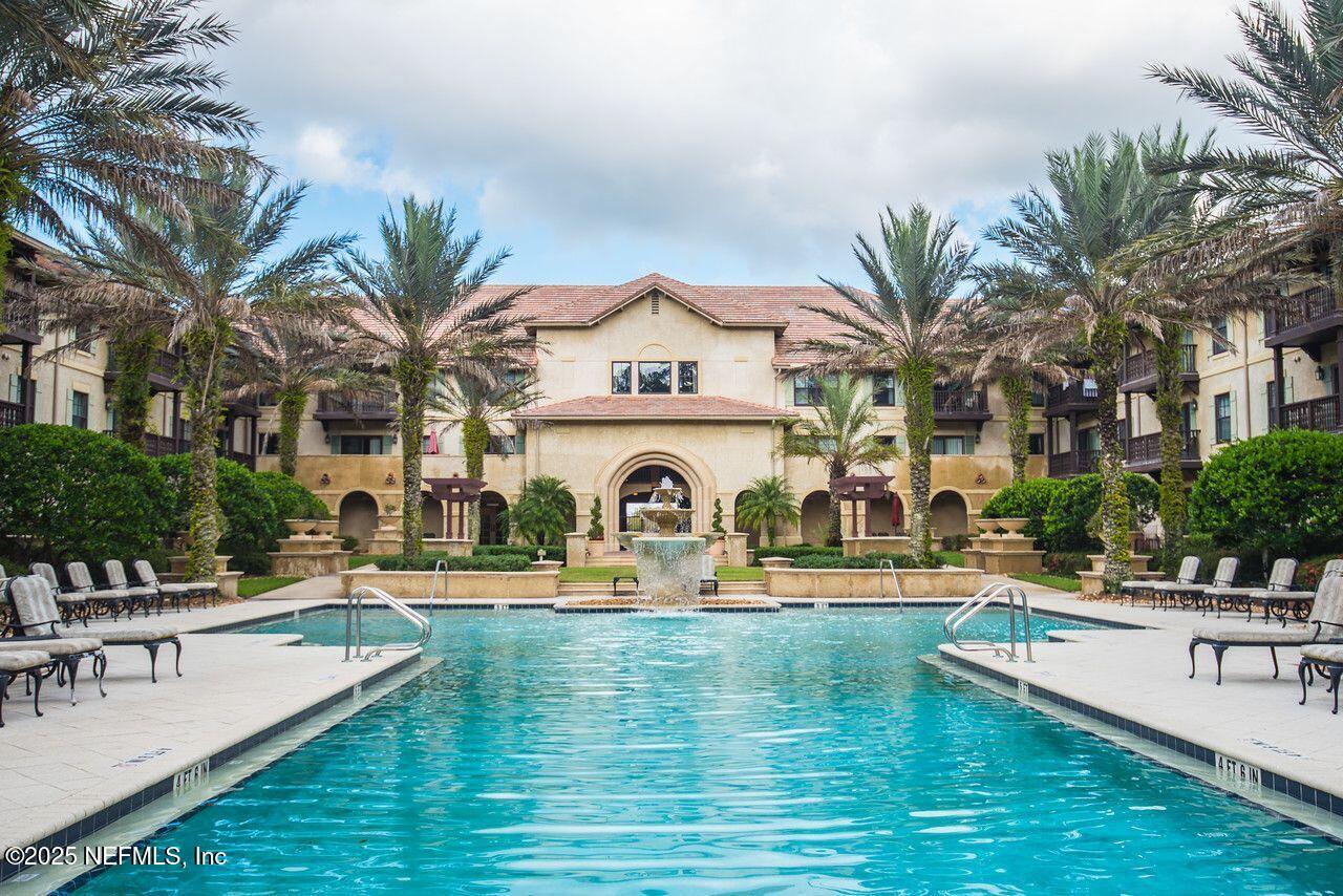 945 Registry Boulevard, Unit 212 St. Augustine, FL 32092 - Photo 13 of 26 a swimming pool with outdoor seating and yard