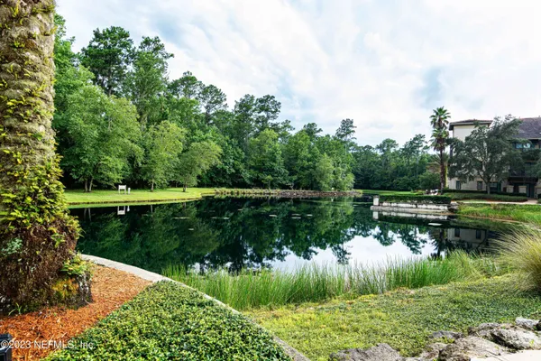 a view of lake with green space