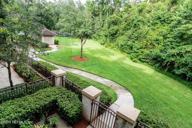 a view of a house with a backyard porch and sitting area