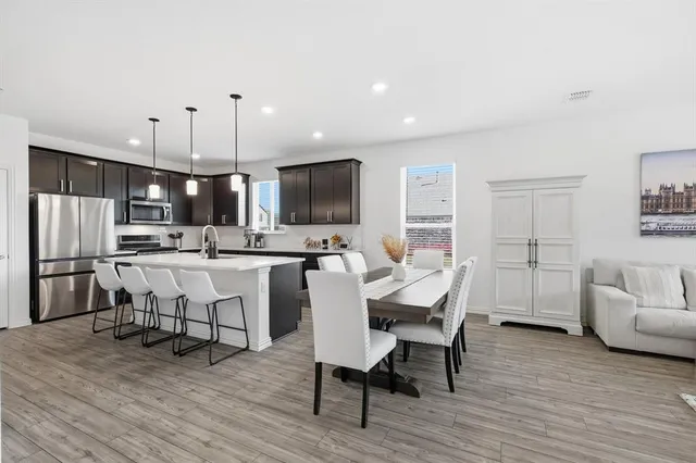 a view of kitchen with microwave and cabinets