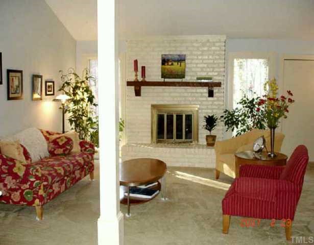 10204 Roadstead Way West Raleigh, NC 27613 - Photo 2 of 7 a living room with furniture flower pot and a fireplace
