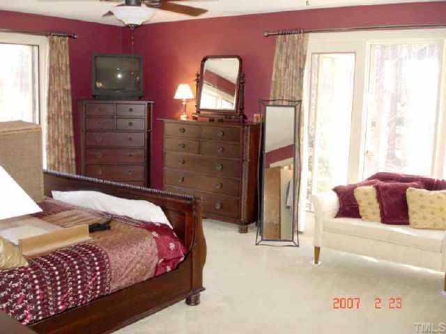 10204 Roadstead Way West Raleigh, NC 27613 - Photo 5 of 7 a bedroom with a bed and a dresser