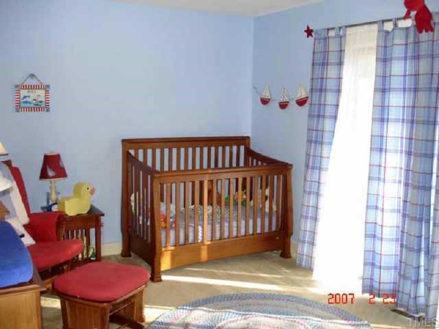 10204 Roadstead Way West Raleigh, NC 27613 - Photo 6 of 7 a bedroom with furniture and a chair