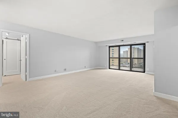 a kitchen with stainless steel appliances granite countertop a refrigerator a stove a sink and a microwave