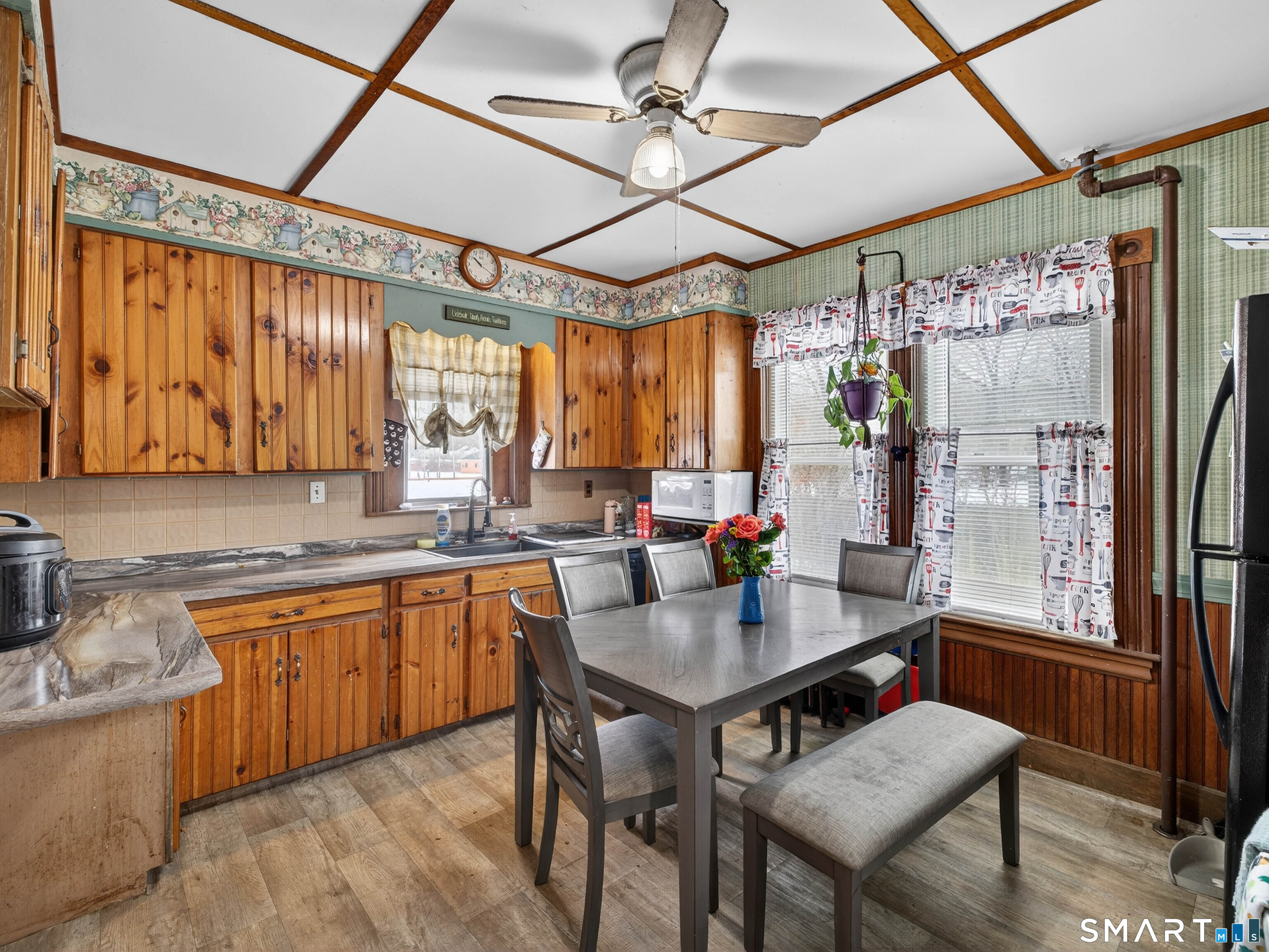 25 Torrey Lane Plainfield, CT 06332 - Photo 13 of 35 a open kitchen with a table chairs stove and refrigerator